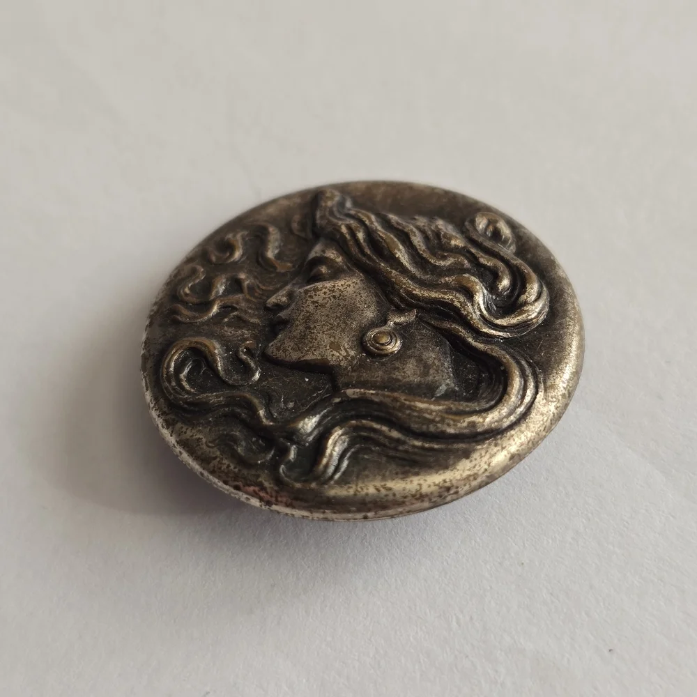 Art Nouveau style brooch woman with flowing hair dark silver tone pin
